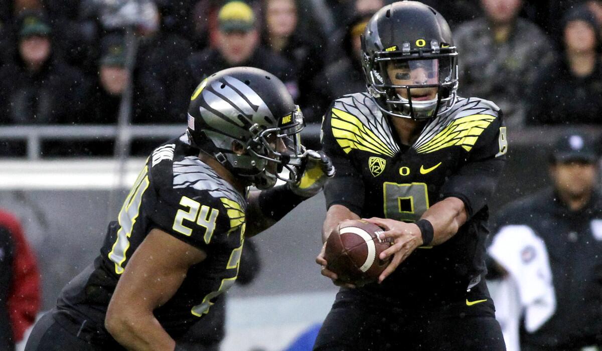 Quarterback Marcus Mariota, preparing to hand off to running back Thomas Tyner, and Oregon have perfected the read-option offense and will test Florida State with it in the Rose Bowl on Thursday.