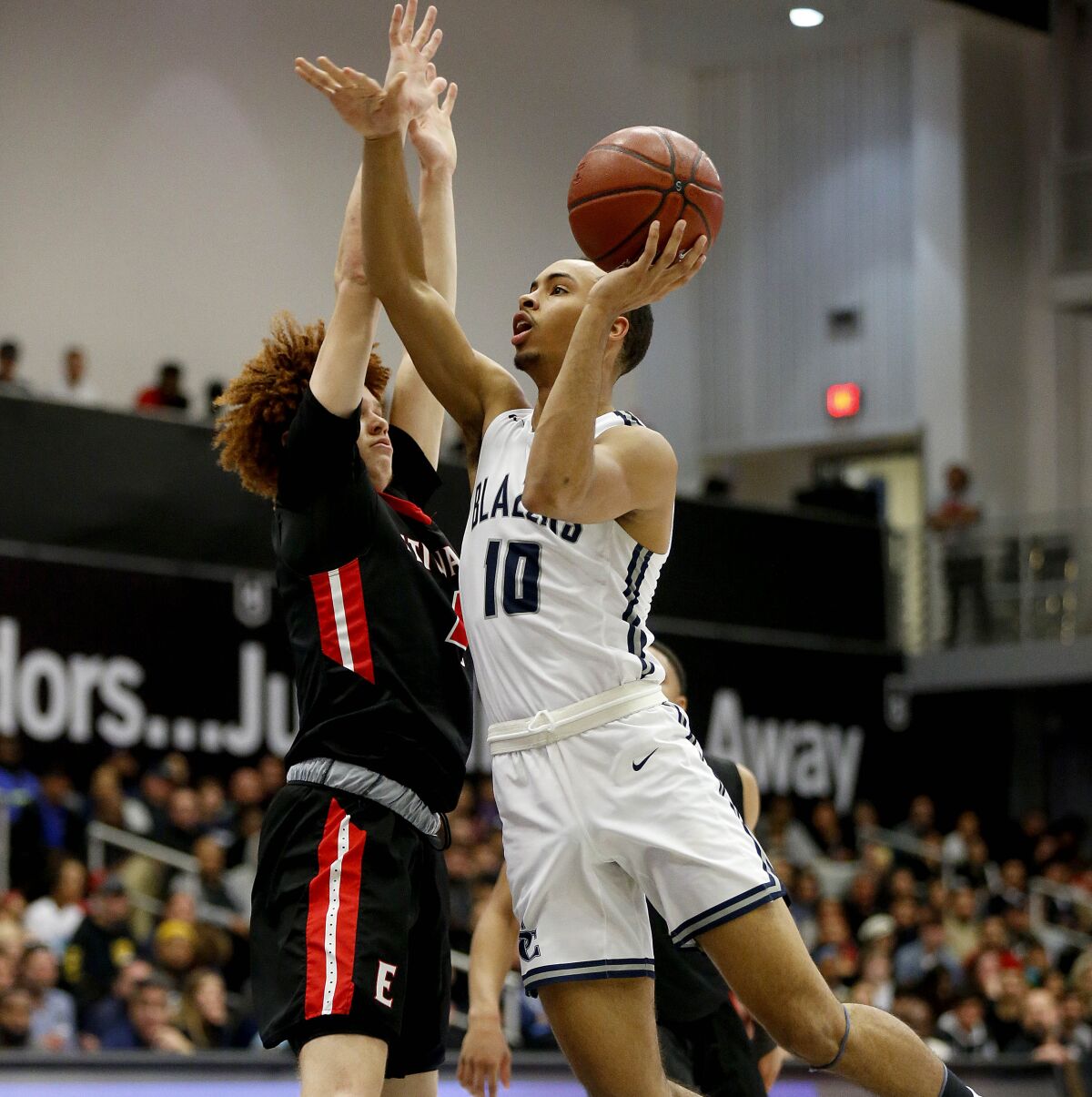 Sierra Canyon's Amari Bailey drives to the basket against Etiwanda's Brantly Stevenson in March 2020. 
