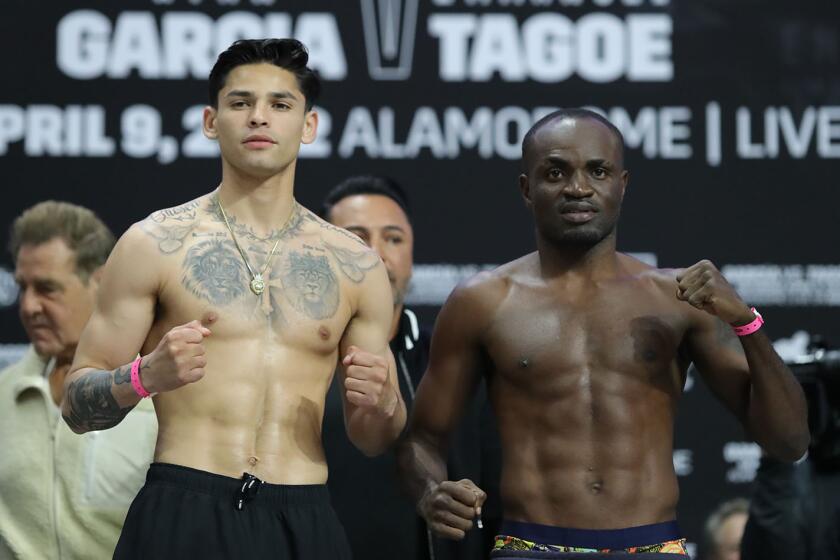 Ryan Garcia and Emannuel Tagoe face a crowd gathered at their weigh-in in San Antonio Friday.