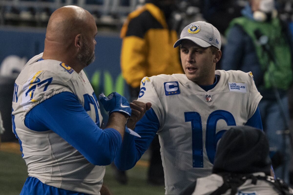 Rams offensive lineman Andrew Whitworth celebrates with quarterback Jared Goff.