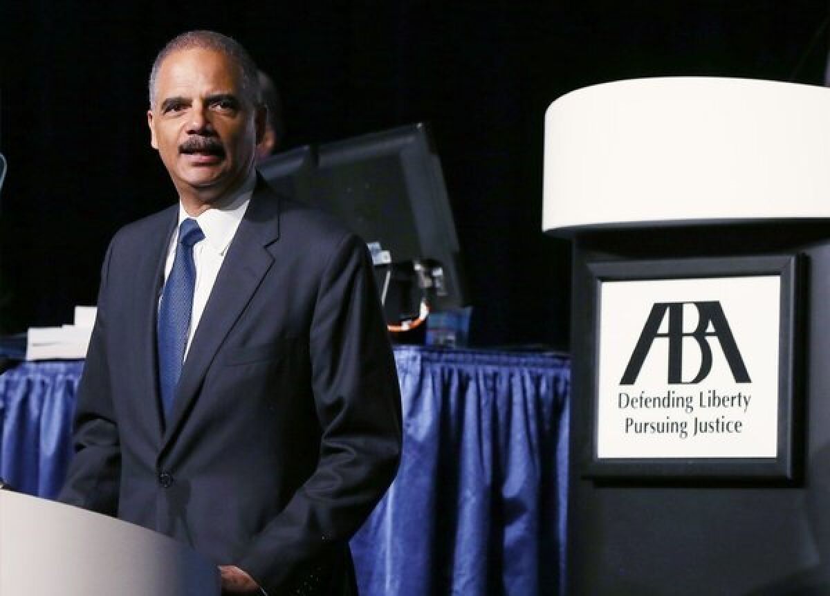 U.S. Atty. Gen. Eric Holder, seen here speaking during the 2013 America Bar Assn. annual meeting on Tuesday, announced major changes in the sentencing of certain drug-related crimes in an effort to reduce overcrowding in the nation's prisons.