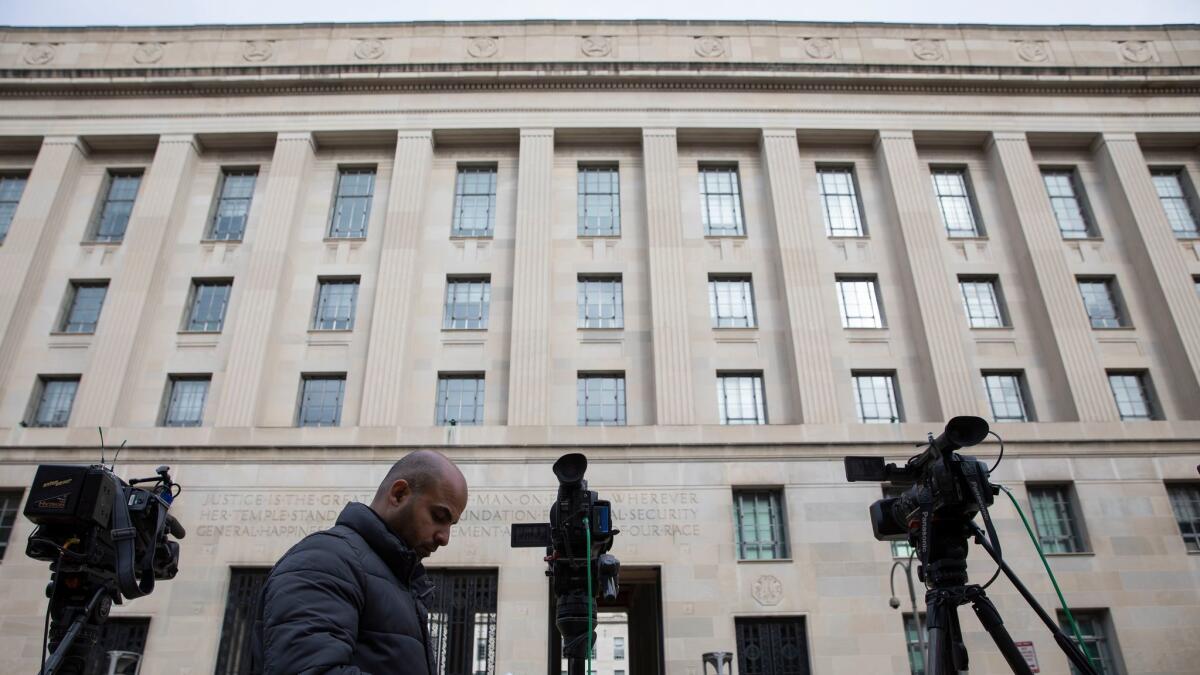 News crews gathered outside the Justice Department in March when Atty. Gen. William Barr released his summary of the Mueller report.