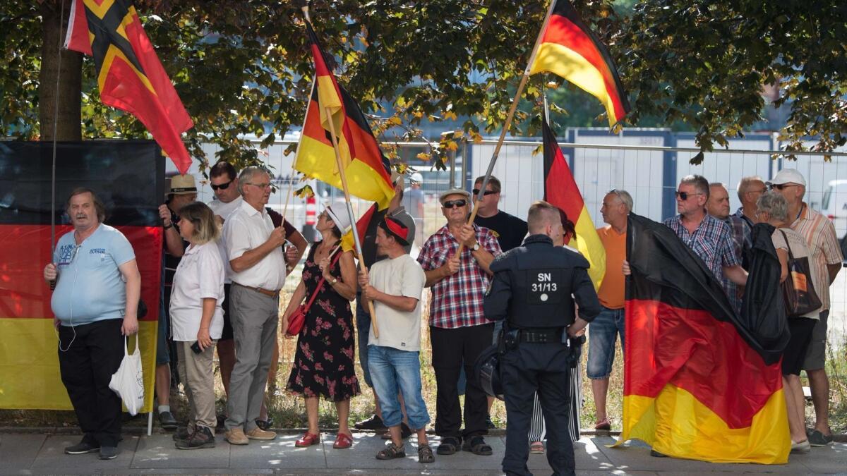 Anti-Islam PEGIDA movement supporters demonstrate on the occasion of the Chancellor's visit at the Saxon state parliament Aug. 16 in Dresden, eastern Germany.