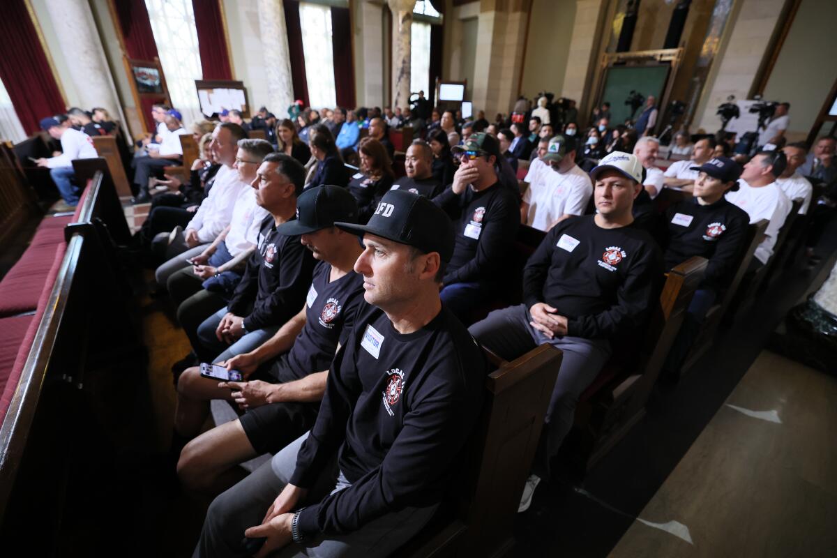 Members of the Los Angeles Fire Department fill the council chambers to show support for former Fire Chief Kristin Crowley.