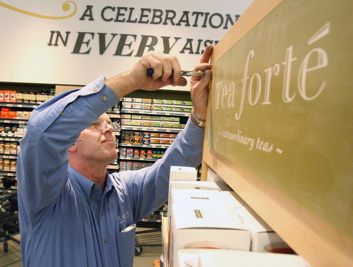Merchandising manager Chris Kelley, who has worked with Gelson's for 29 years, fixes up the tea display at the store's new location in La Cañada Flintridge on Monday, March 24, 2014. The store will have its grand opening on March 27 at 9:00 A.M.