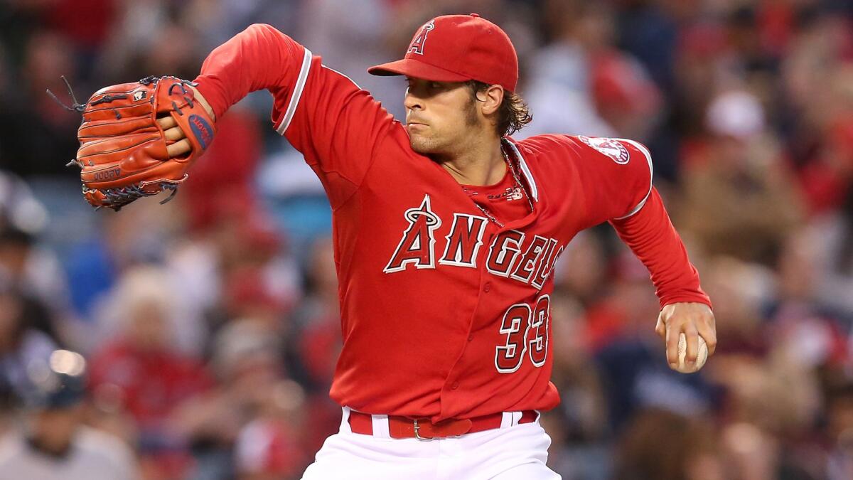 Angels starter C.J. Wilson delivers a pitch during the team's 4-3 loss to the New York Yankees on Tuesday.