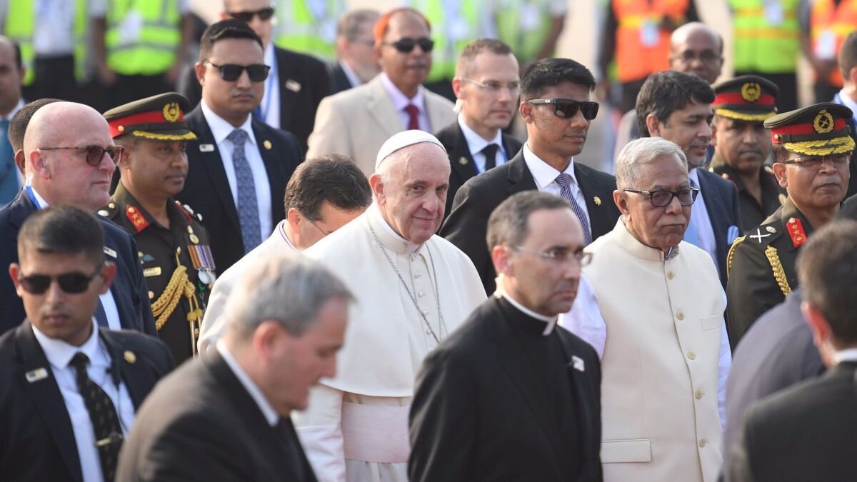 Pope Francis arrives at the airport in Dhaka, the capital of Bangladesh.