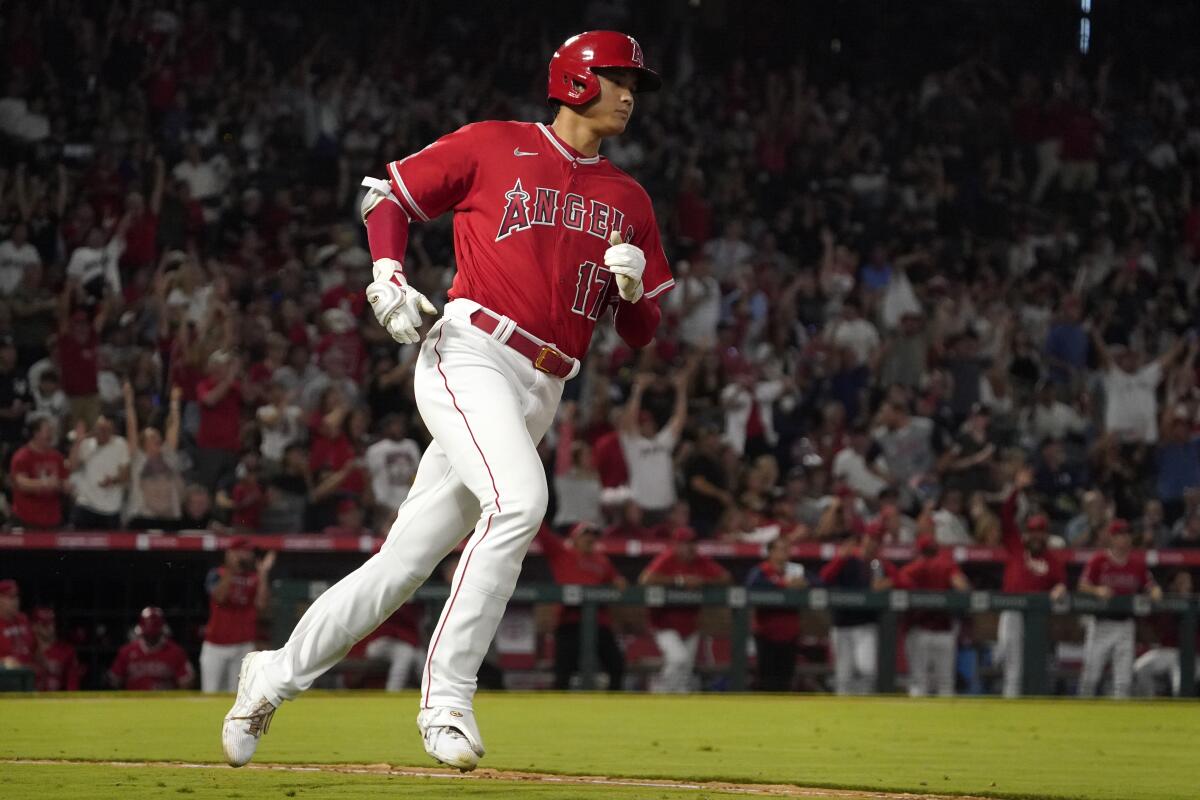 Angels' Shohei Ohtani heads to first after hitting a two-run home run.