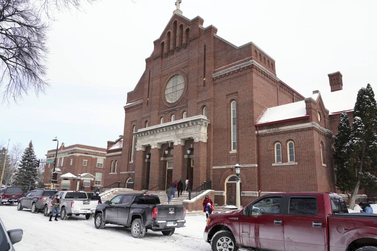The facade of a church on a snow-covered street