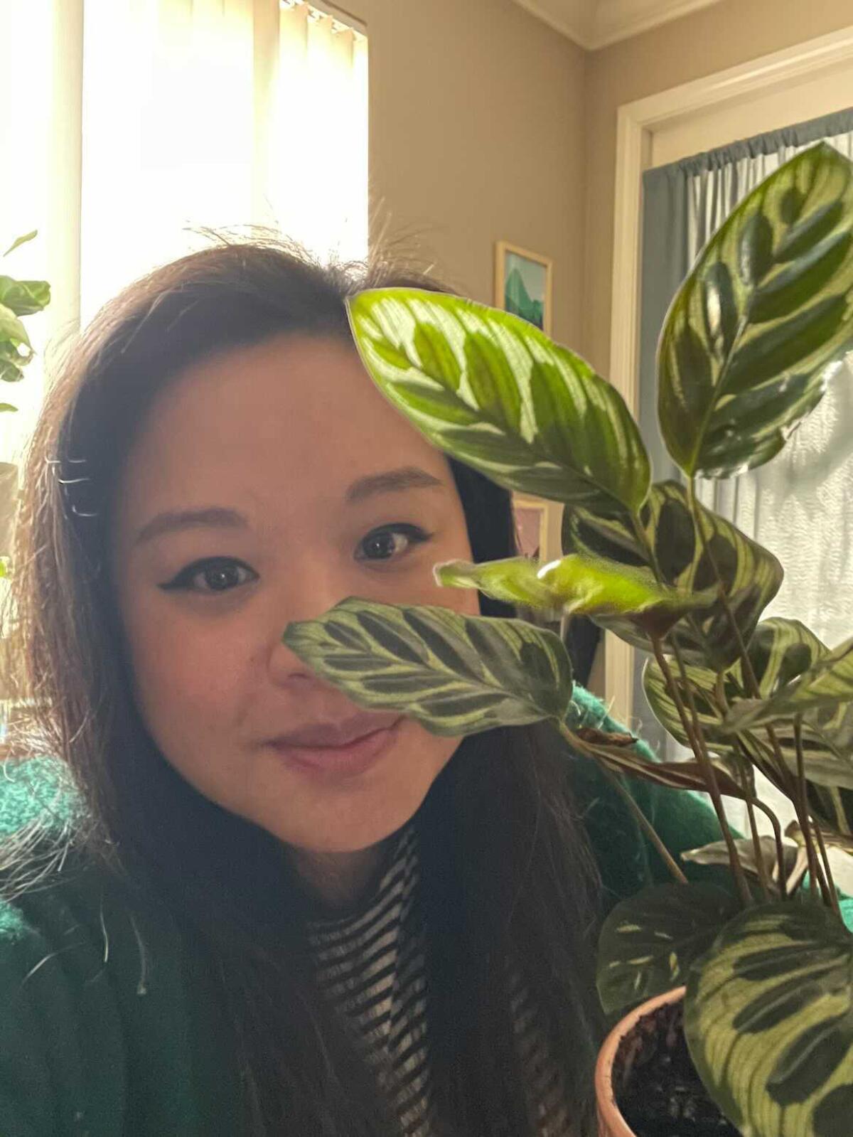 Reader Jennifer Chen with a prayer plant