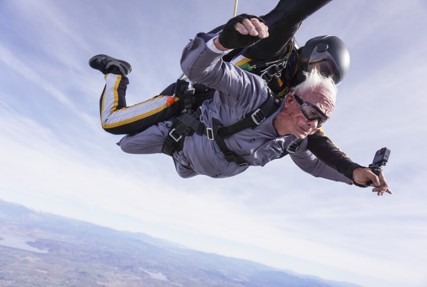 Stanley Rohrer of Valley Center, bottom, a double amputee who will be 90 on January 7th, skydives with tandem instructor Romulo Rangel high above the earth with Skydive Elsinore on January 3, 2020, in Lake Elsinore, California.