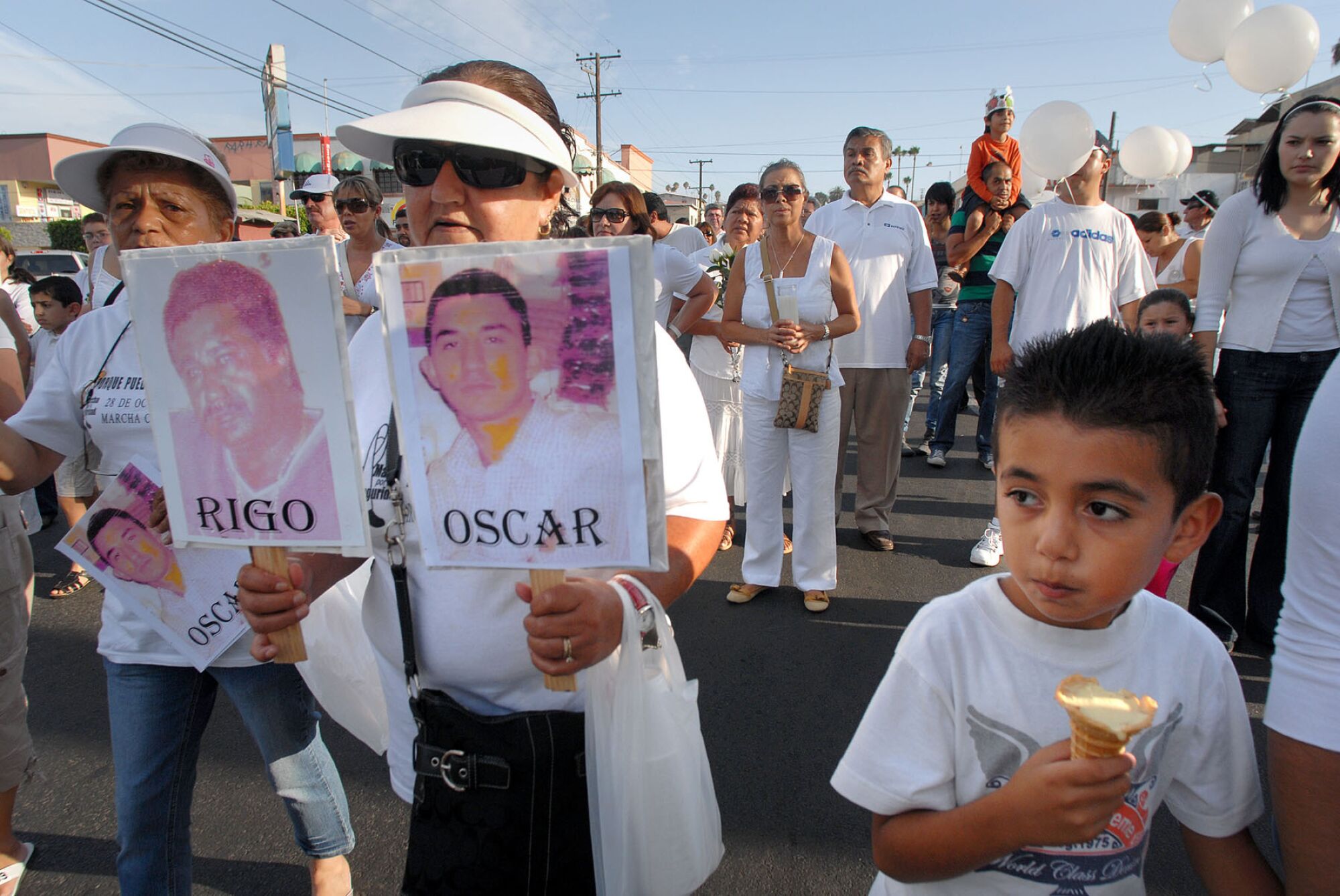 People walk through the streets of Tijuana to protest crime in 2008.