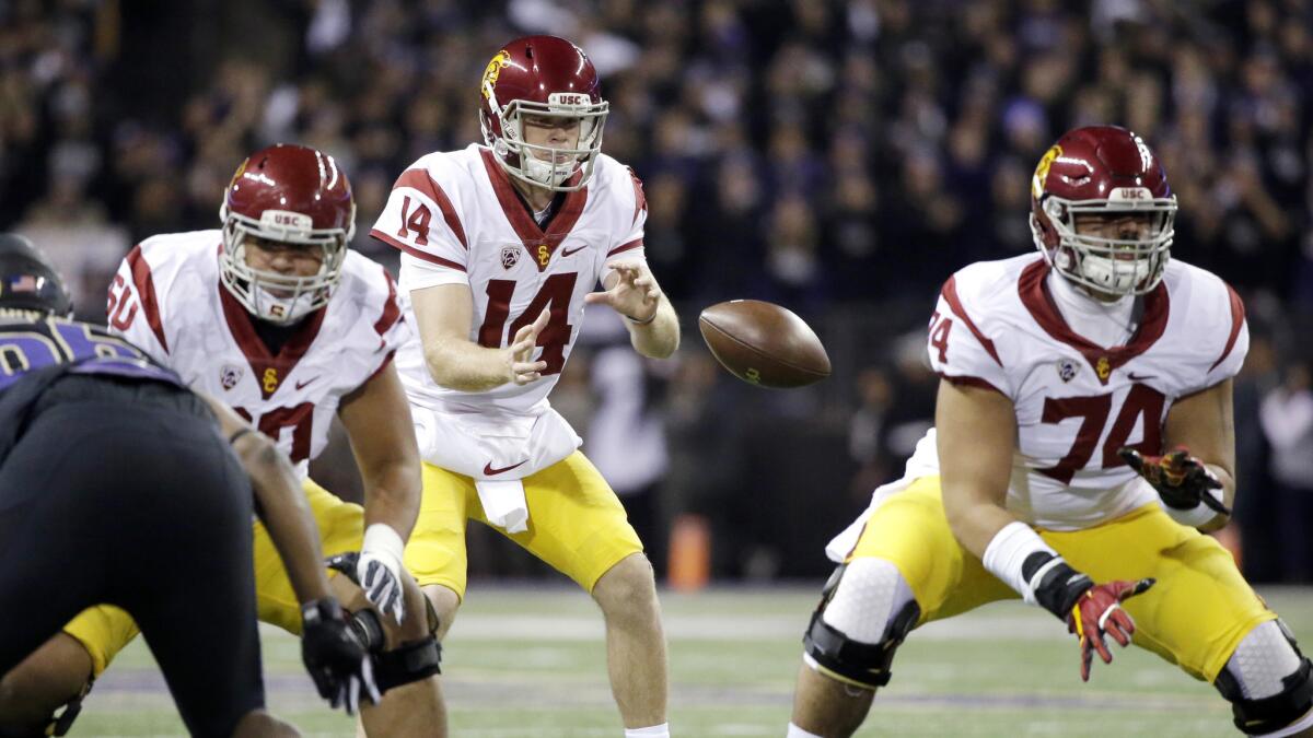 Line play protecting USC quarterback Sam Darnold (14) and UCLA quarterback Mike Fafaul (not pictured) will be critical during Saturday's rivalry game.