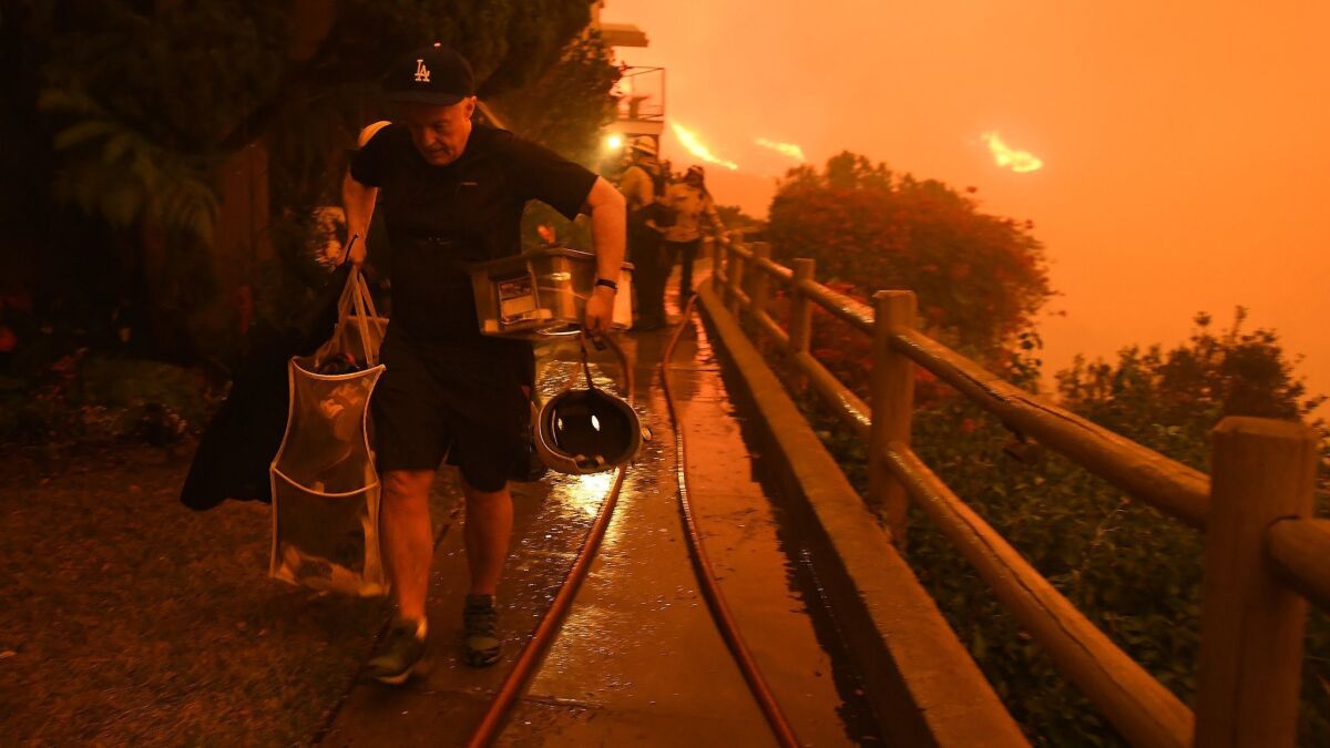 Resident Brett Hammond evacuates in Malibu as the Woolsey fire approaches.