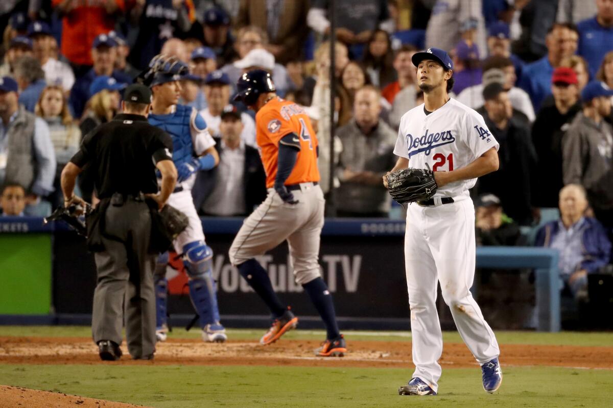 Yu Darvish of the Dodgers reacts after George Springer of the Astros homers in Game 7 of the 2017 World Series.