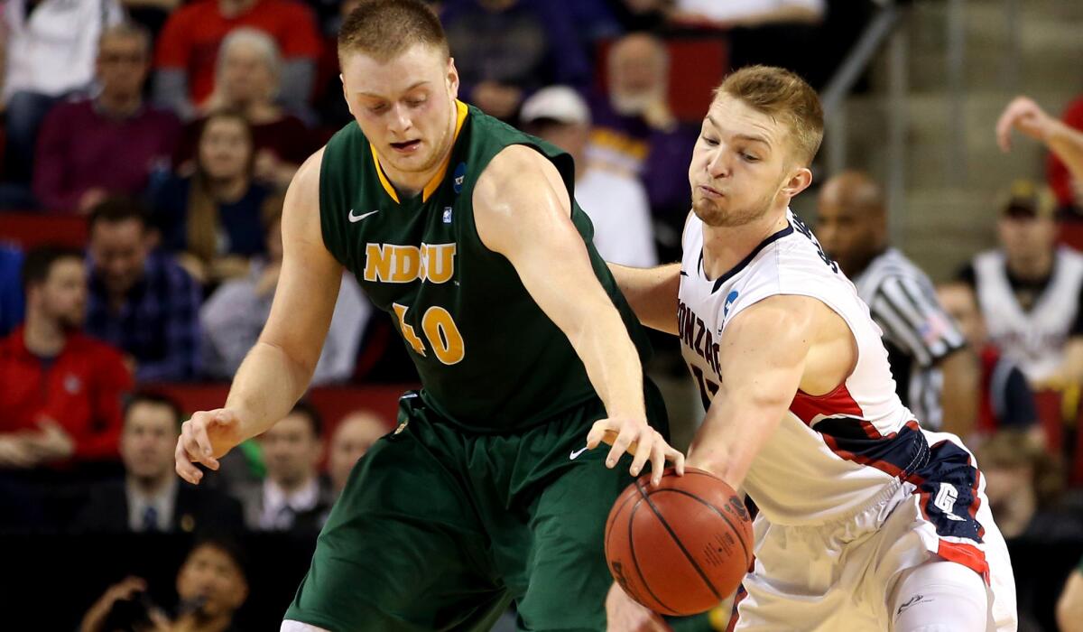 Gonzaga forward Domantas Sabonis tries to steal the ball from North Dakota State forward Dexter Werner in the second half of the Bulldogs' 86-76 victory on Friday night.