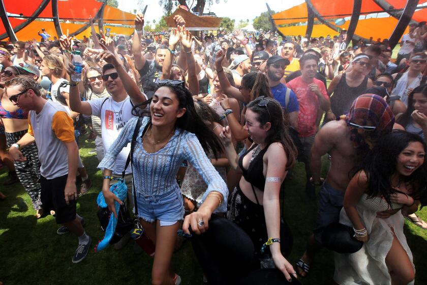 Music fans get into the beats at the Do Lab on Day 1 of the Coachella Valley Music and Arts Festival in Indio, Calif., on Friday.