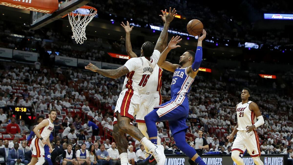 Philadelphia 76ers guard Ben Simmons shoots in the first quarter as Miami Heat forward James Johnson (16) defends.