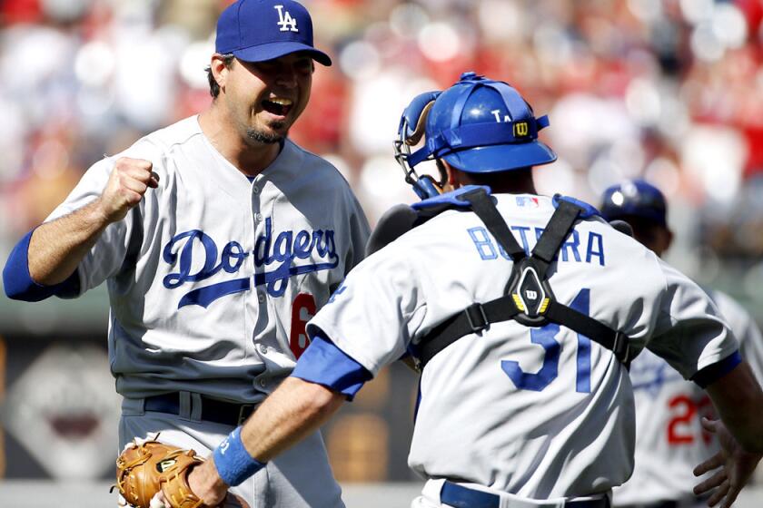 Dodgers catcher Drew Butera celebrates with pitcher Josh Beckett after he struck out Chase Utley to complete a no-hitter on Sunday afternoon in Philadelphia.