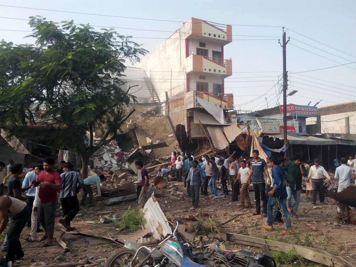 People gather at the explosion site in Jhabua district in central India.