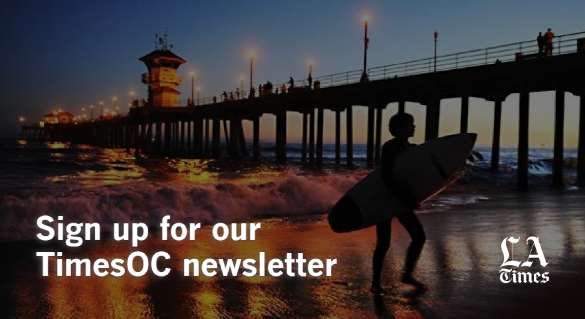 "Sign up for our TimesOC newsletter" and the L.A. Times logo over the Huntington Beach Pier at sunset.