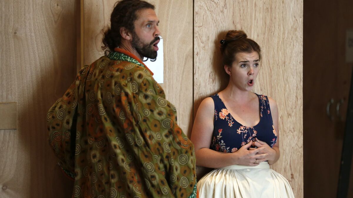 John Moore, left, and Sarah Shafer rehearse a scene from San Diego Opera's season-opening production of Wolfgang Amadeus Mozart's "The Marriage of Figaro."