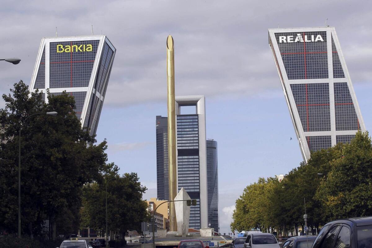 The Bank of Spain in Madrid, above, announced that the nation's recession was over.