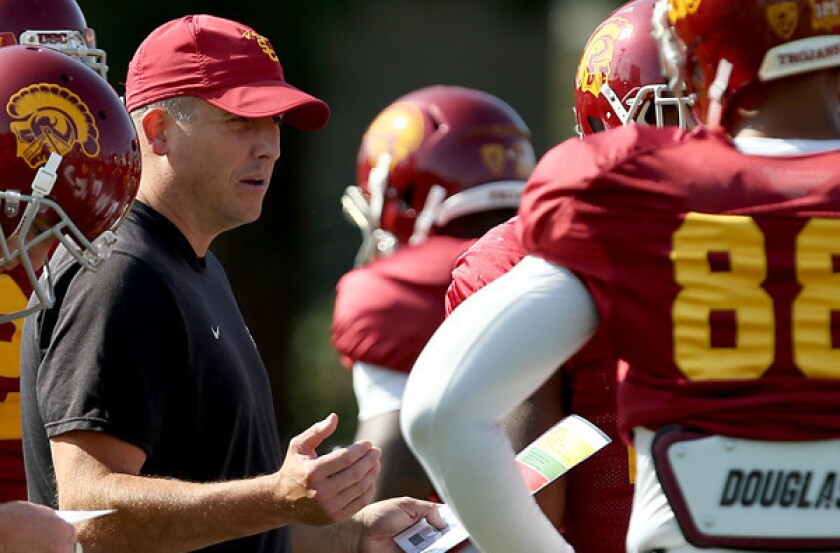 USC offensive coordinator Clay Helton is the second interim coach for the Trojans this season.