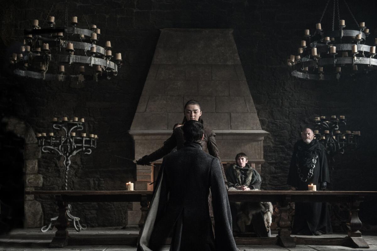 Maisie Williams as Arya Stark, Aidan Gillen as Petyr “Littlefinger” Baelish and Isaac Hempstead Wright as Bran Stark in the "Game of Thrones" episode “The Dragon and the Wolf.” (Helen Sloan / HBO)