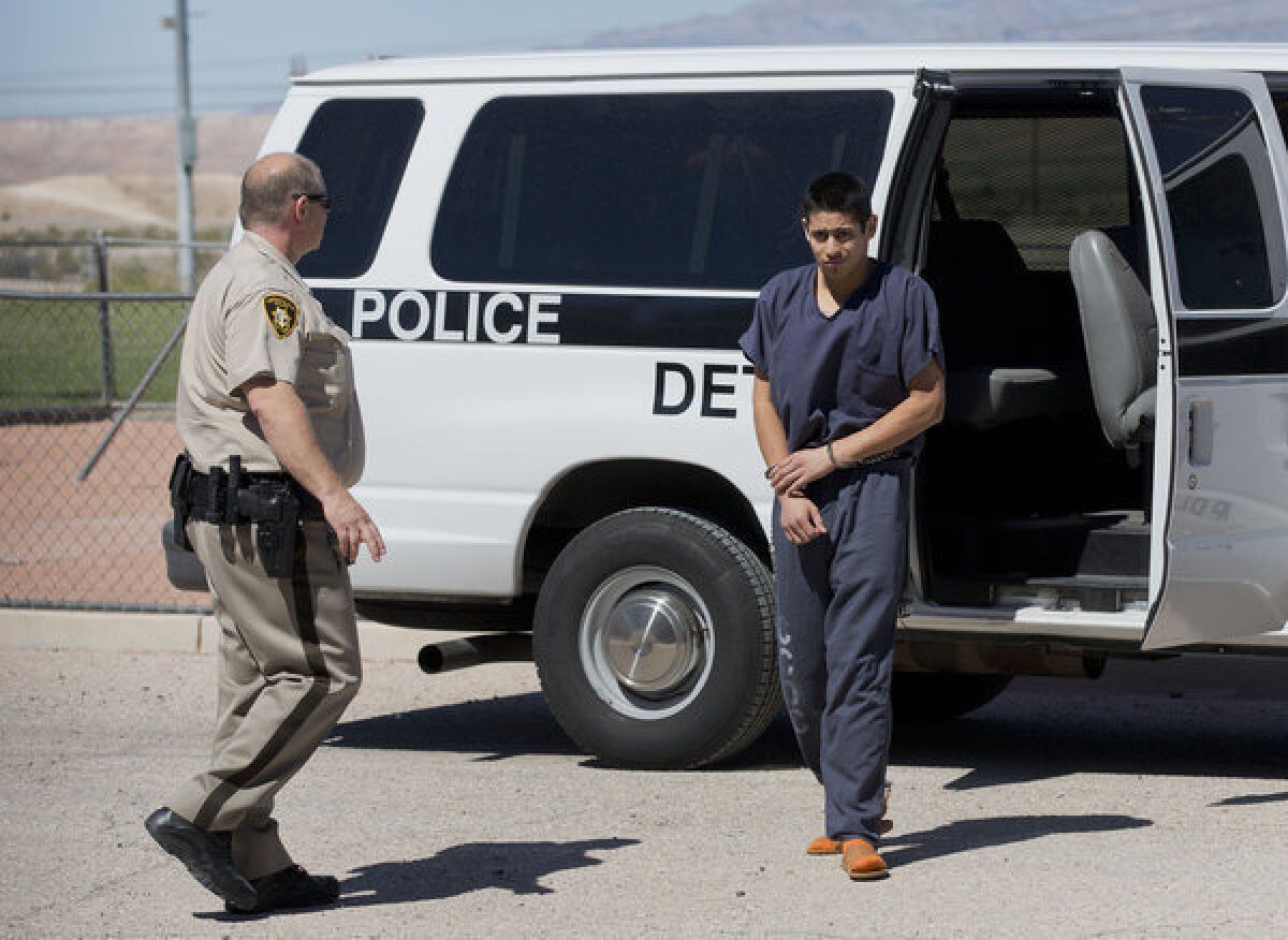 Escorted by Las Vegas Metro Police officers, Jean Ervin Soriano steps out of a van upon arriving at Moapa District Court on Wednesday to appear on charges of drunk driving and causing a crash that killed five members of a Southern California family on a Nevada freeway last month.