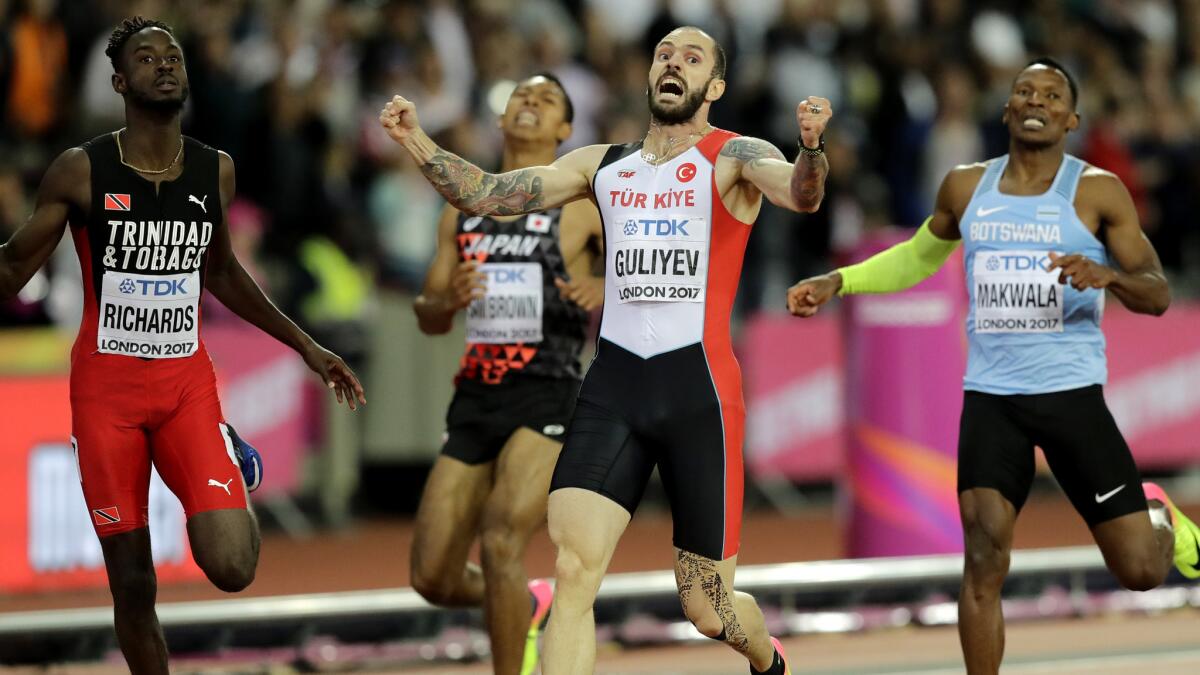 Ramil Guliyev celebrates after winning the gold medal in the 200 meters on Thursday.