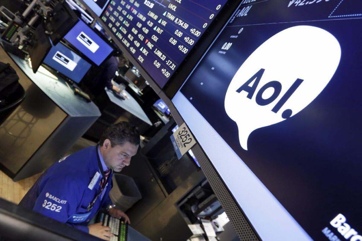 Specialist Ronnie Howard on the floor of the New York Stock Exchange on Tuesday. AOL Inc.'s stock soared in response to a merger deal with Verizon Communications Inc.