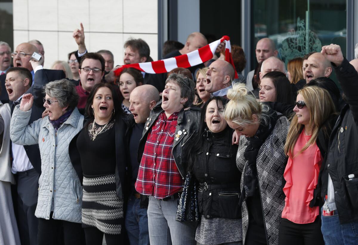 Relatives of those who died in the Hillsborough disaster sing "You'll Never Walk Alone" outside outside the Hillsborough inquest in Warrington, England, on April 26.