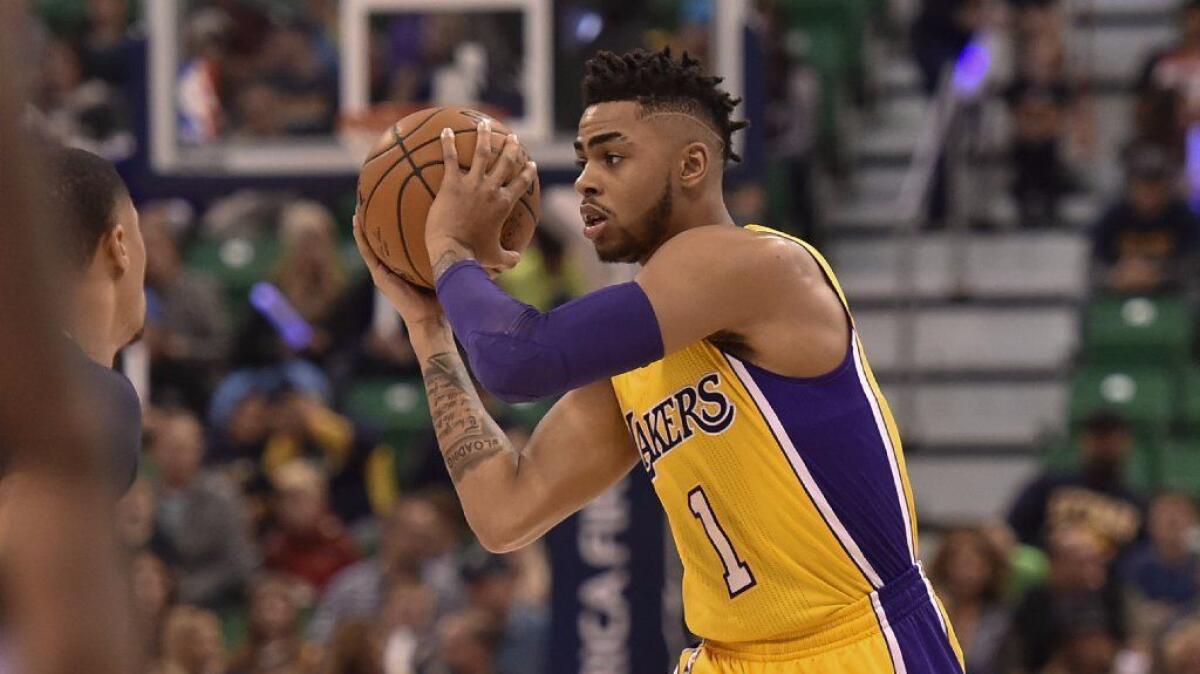 Lakers guard D'Angelo Russell controls the ball during the first half of a game against the Utah Jazz on Oct. 28.
