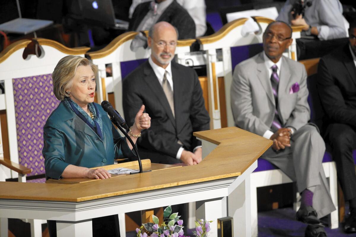 Hillary Clinton visits Triumph Baptist Church in Philadelphia on April 21. Pennsylvania Gov. Tom Wolf, center, and Pastor James S. Hall Jr. are seated behind her.