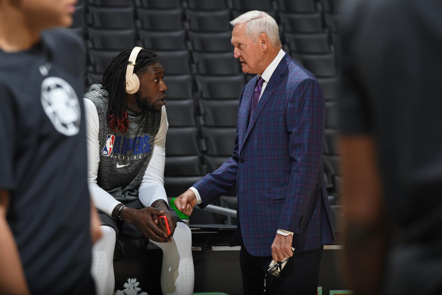 Jerry West talks with Clippers' Montrezl Harrell before a game against the Charlotte Hornets on Oct. 28 at Staples Center.