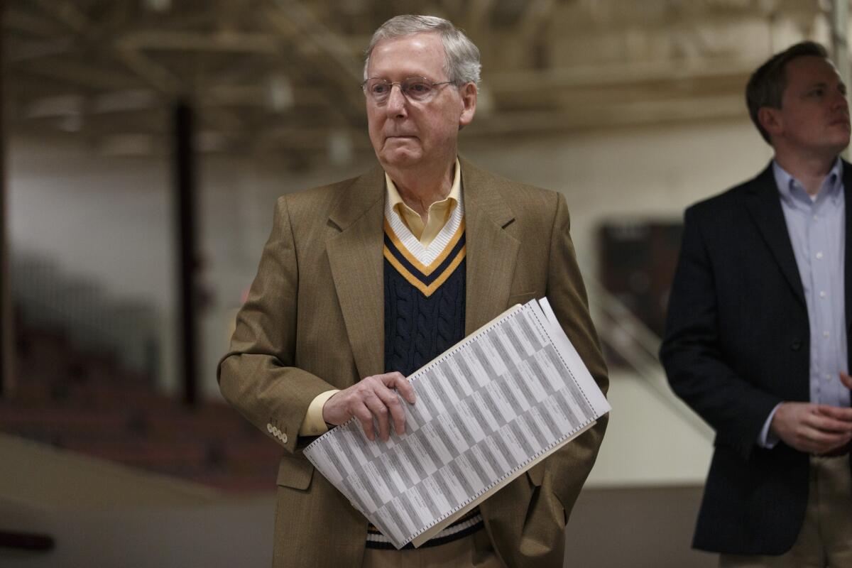 Senate Minority Leader Mitch McConnell (R-Ky.) prepares to cast his ballot in Louisville, Ky., on Nov. 4.