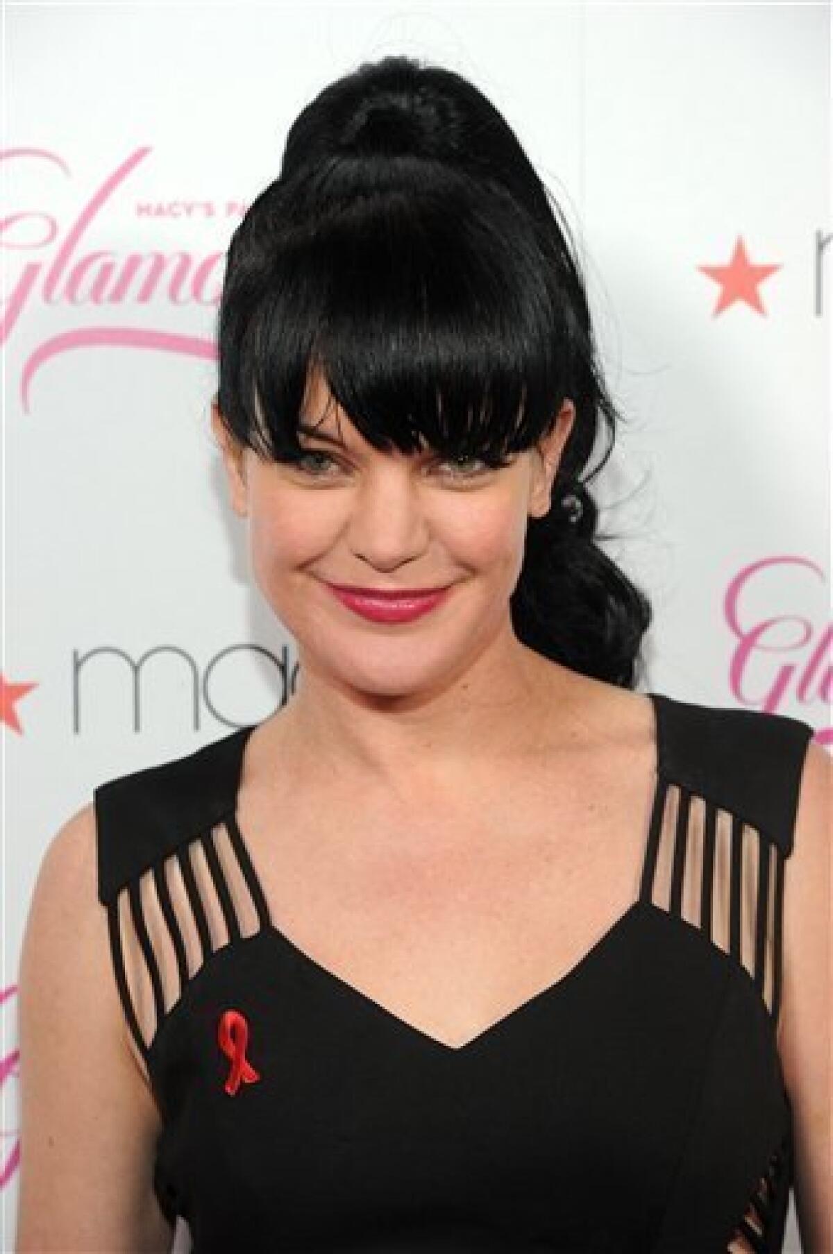 FILE - In this Sept. 23, 2011 file photo, actress Pauley Perrette arrives at the 2011 Macy’s Passport Presents Glamorama at the Orpheum Theatre in Los Angeles, Calif. Perrette portrays Abby Sciuto, the Goth lab rat on CBS' crime procedural, "NCIS." In its ninth season, "NCIS" remains a smash hit, averaging 20 million viewers a week. (AP Photo/Kristian Dowling, file)