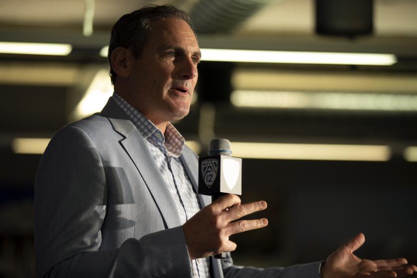 Commissioner Larry Scott speaks during the Pac-12 NCAA college basketball media day.
