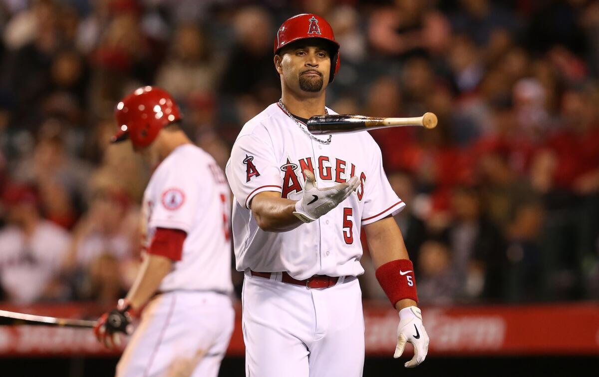 Angels slugger Albert Pujols flips his bat after striking out with the bases loaded against the Athletics last week.