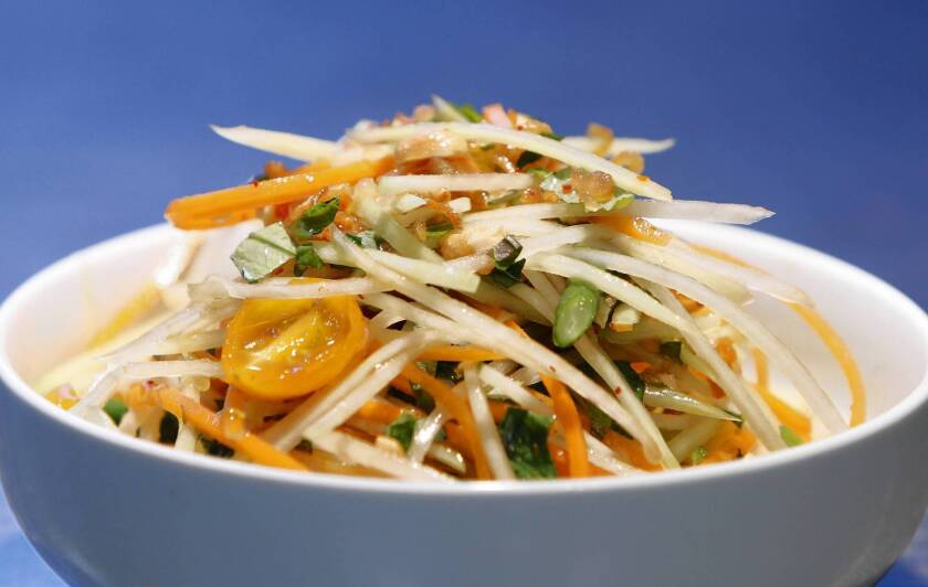 In a green papaya salad, salty fish sauce plays off the flavors of the unripe fruit, tart limes and spicy chiles.
