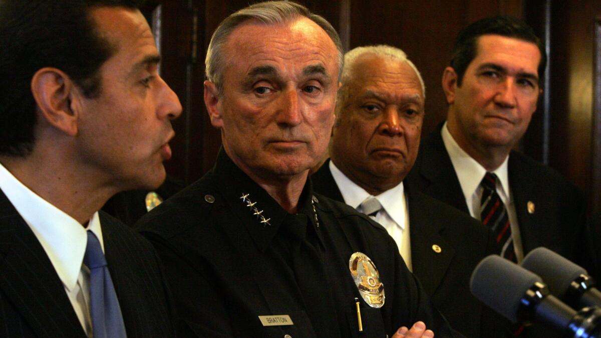 Police Chief William J. Bratton looks at Mayor Antonio Villaraigosa during a 2007 news conference at City Hall. (Genaro Molina / Los Angeles Times)