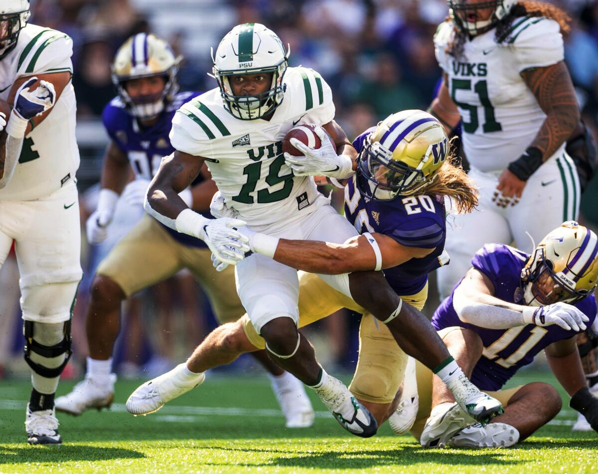 Portland State's Jalynnee McGee (19) is tackled short of the goal line by Washington's Asa Turner, forcing Portland State into a field goal in the second quarter of an NCAA college football game, in Seattle, Saturday, Sept. 10, 2022. (Dean Rutz/The Seattle Times via AP)