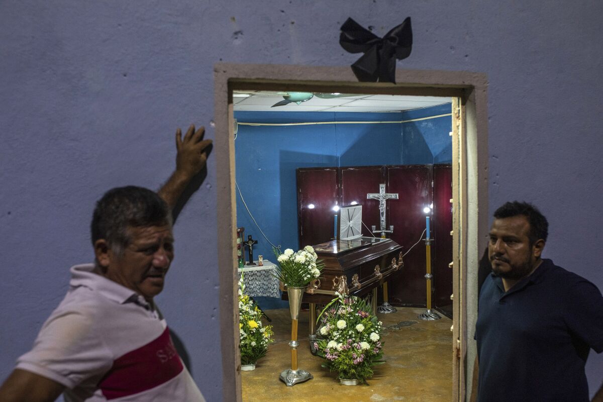 A black ribbon hangs outside the family home of video-journalist Sheila Johana Garcia Olivera where her remains lay during her wake in Minatitlan, Veracruz state, Mexico, Tuesday, May 10, 2022. Garcia is one of two journalists from the online news site El Veraz in Cosoleacaque who were shot to death on May 9, raising to 11 the number of such killings in the country this year. (AP Photo/Felix Marquez)