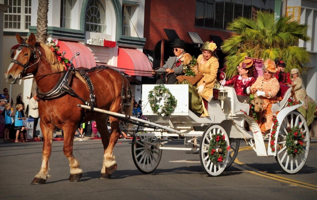 A scene from a previous La Jolla Christmas Parade. The 2019 event starts 1:30 p.m. Sunday, Dec. 8 with the parade route on Girard Avenue and Prospect Street. A Holiday Festival outside the Athenaeum Music & Arts Library, 1008 Wall St., runs 11 a.m. to 1 p.m. prior to the start of the parade.