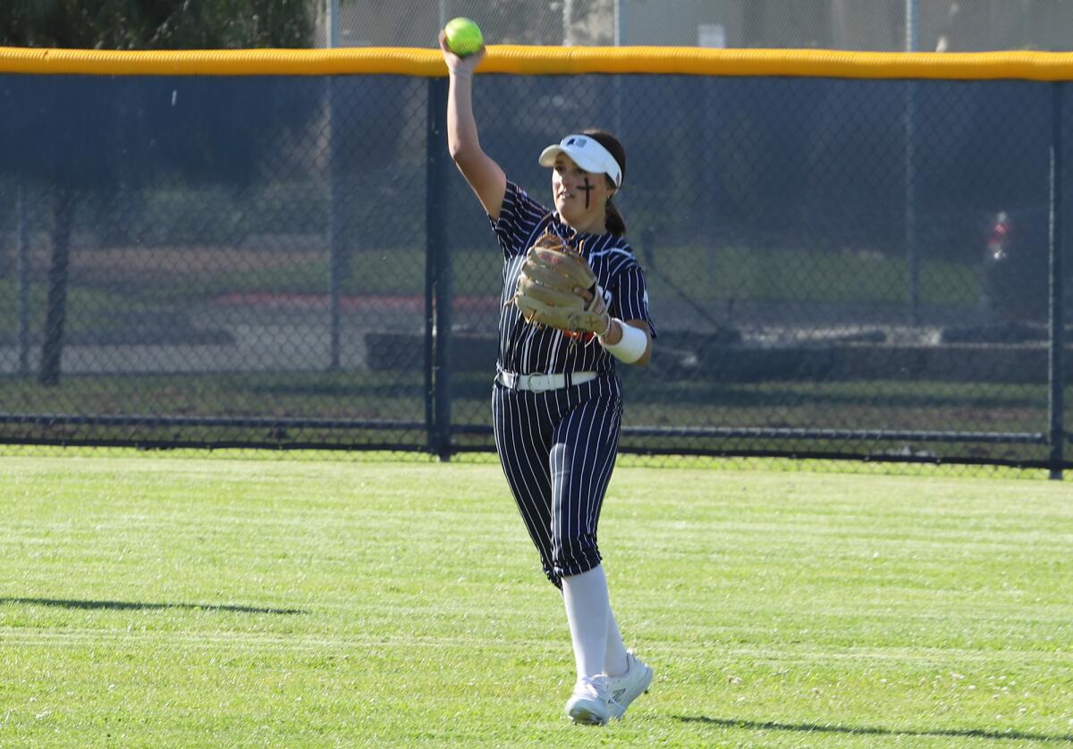 Newport Harbor center fielder Alexis Vanhorn (27) makes a catch against Corona del Mar in the Battle of the Bay.