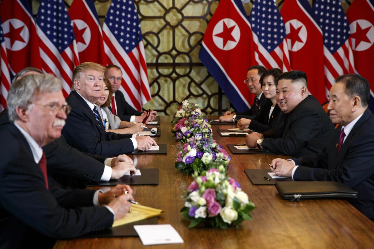 President Trump during a meeting with North Korean leader Kim Jong Un on Feb. 28, 2019, in Hanoi. Kim is accompanied by Kim Yong Chol, a North Korean senior ruling party official and former intelligence chief, front right; Trump has by his side national security adviser John Bolton, front left. 