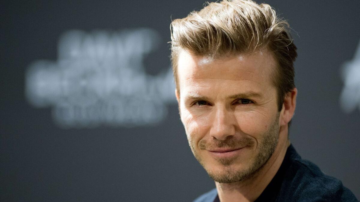 David Beckham is People's 30th-David Beckham, People's 2015 Sexiest Man Alive, doesn't think of himself 'that way'anniversary Sexiest Man Alive.