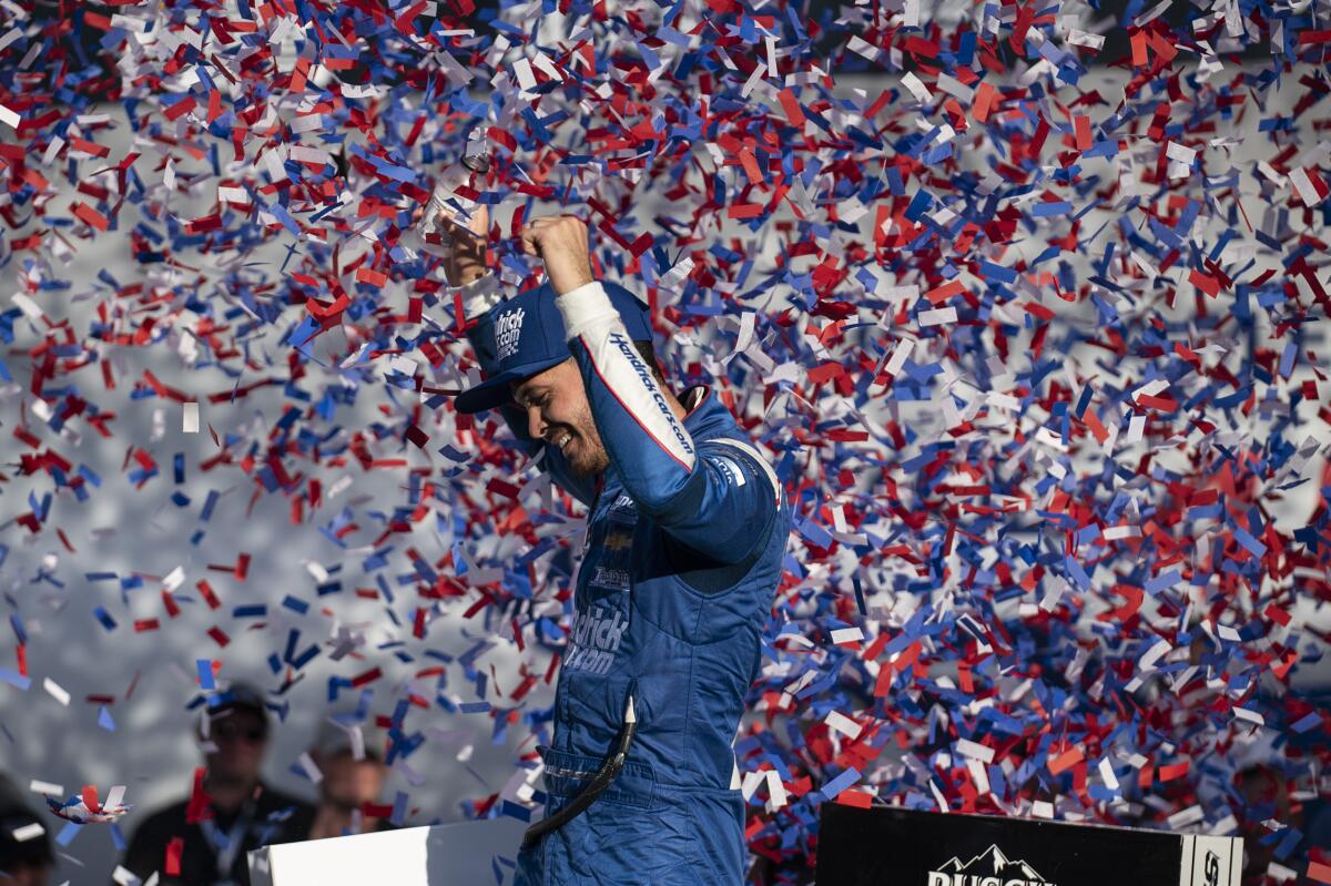 Kyle Larson celebrates in Victory Lane after winning a NASCAR Cup Series auto racing.