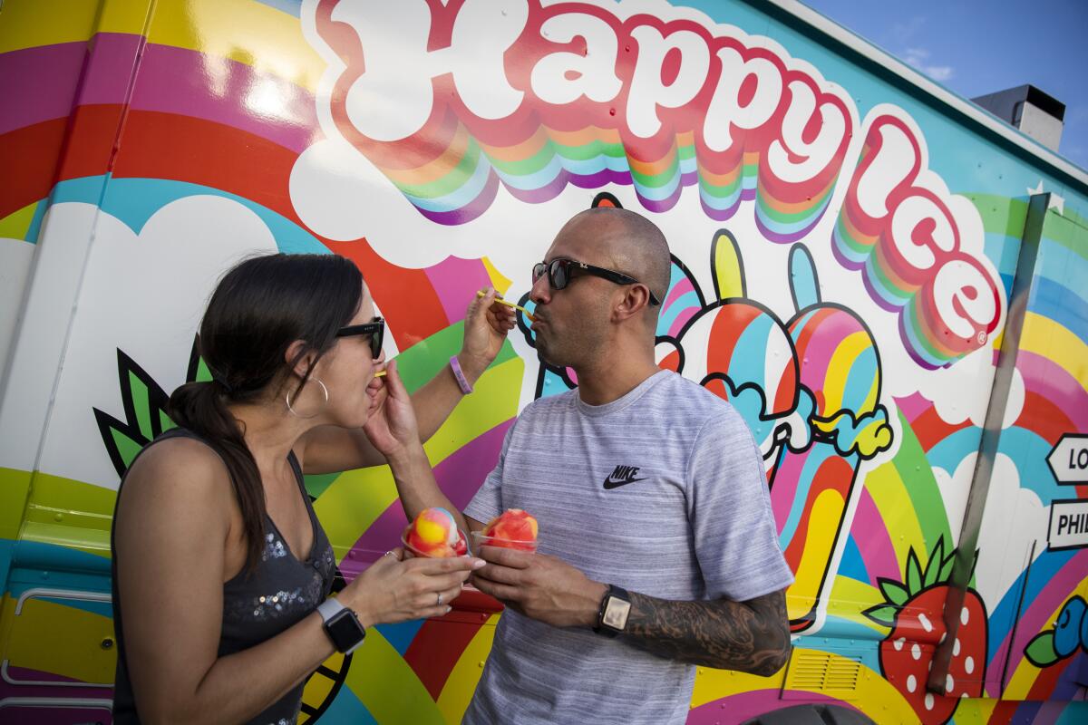 Jenna Sandoval and John Noriega at the Vegan Exchange, a weekly street fair in North Hollywood.